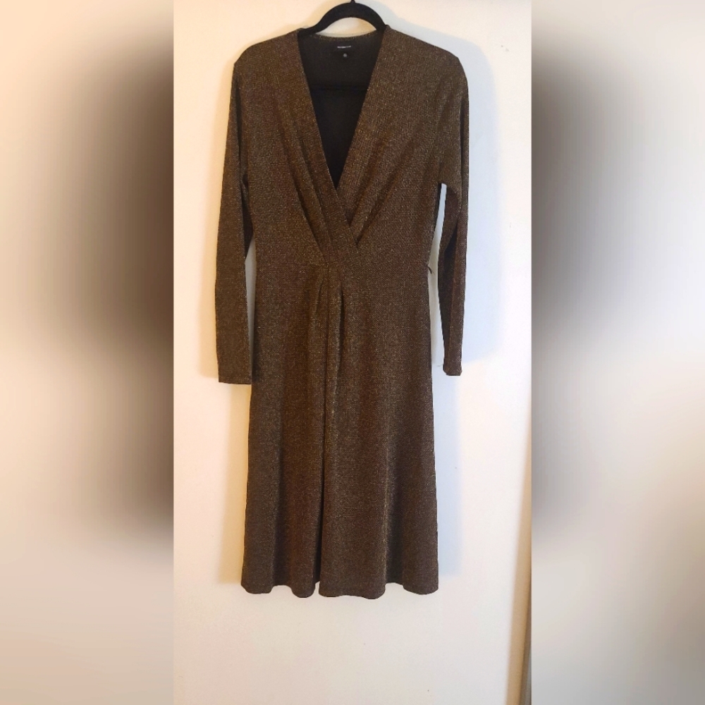 Gold knit midi dress with gold stitching.